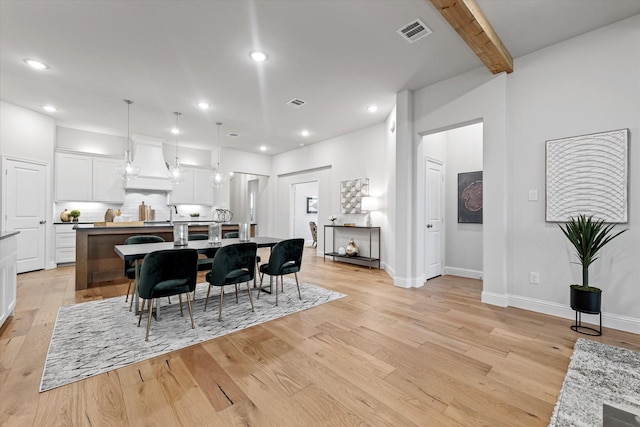 913 Beall St, Denton, TX 76207 - dining room with light wood finished floors, beamed ceiling, visible vents, and recessed lighting