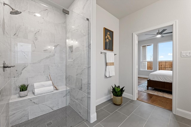 913 Beall St, Denton, TX 76207 - ensuite bathroom with baseboards, ensuite bathroom, ceiling fan, a tile shower, and tile patterned flooring