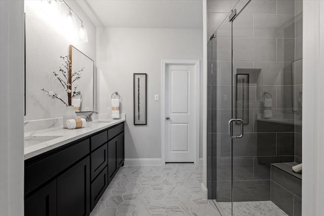 913 Beall St, Denton, TX 76207 - full bathroom with a sink, tile patterned floors, a shower stall, double vanity, and baseboards