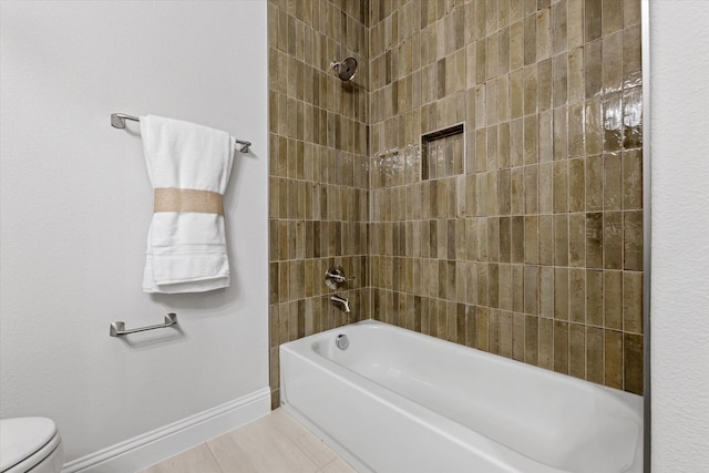 913 Beall St, Denton, TX 76207 - full bathroom with tile patterned floors, toilet, baseboards, and shower / bath combination