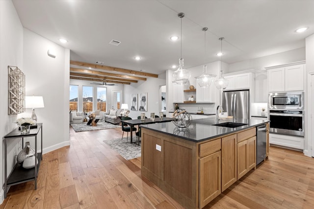 913 Beall St, Denton, TX 76207 - kitchen featuring a sink, stainless steel appliances, dark countertops, and recessed lighting