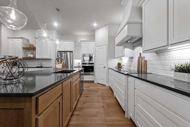 913 Beall St, Denton, TX 76207 - kitchen with premium range hood, a sink, stainless steel appliances, open shelves, and dark countertops