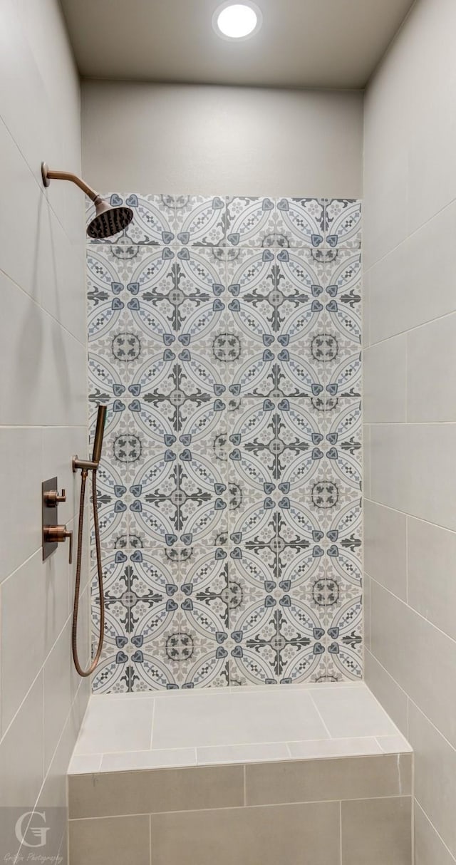 bathroom featuring tiled shower