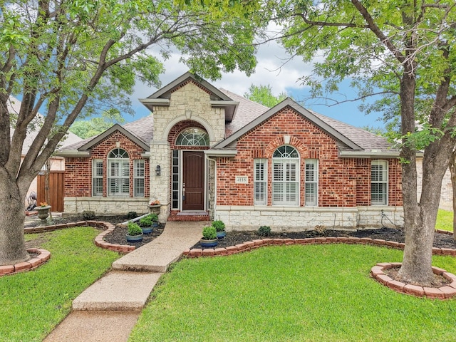 4118 Armistice Dr, Frisco, TX 75034 - view of front of property featuring stone siding, brick siding, and a front lawn