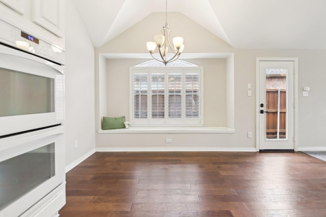 4118 Armistice Dr, Frisco, TX 75034 - unfurnished dining area with vaulted ceiling, dark wood-style flooring, a notable chandelier, and baseboards