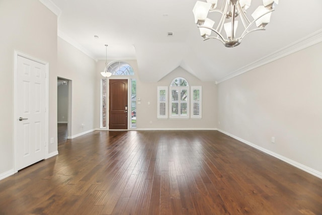 4118 Armistice Dr, Frisco, TX 75034 - interior space featuring lofted ceiling, baseboards, a chandelier, crown molding, and dark wood-type flooring