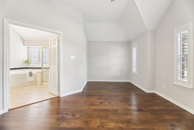 4118 Armistice Dr, Frisco, TX 75034 - spare room with baseboards, lofted ceiling, and hardwood / wood-style floors