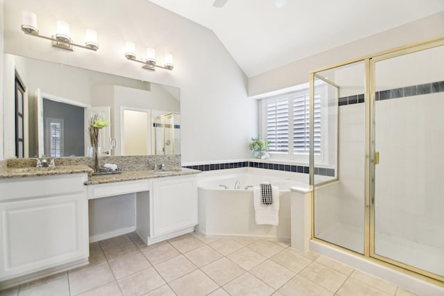 4118 Armistice Dr, Frisco, TX 75034 - full bath featuring a sink, tile patterned floors, a bath, a shower stall, and lofted ceiling