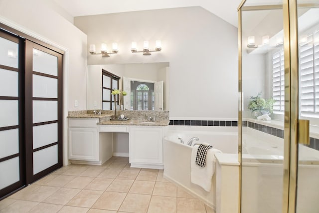 4118 Armistice Dr, Frisco, TX 75034 - full bathroom featuring lofted ceiling, a sink, tile patterned floors, a garden tub, and double vanity