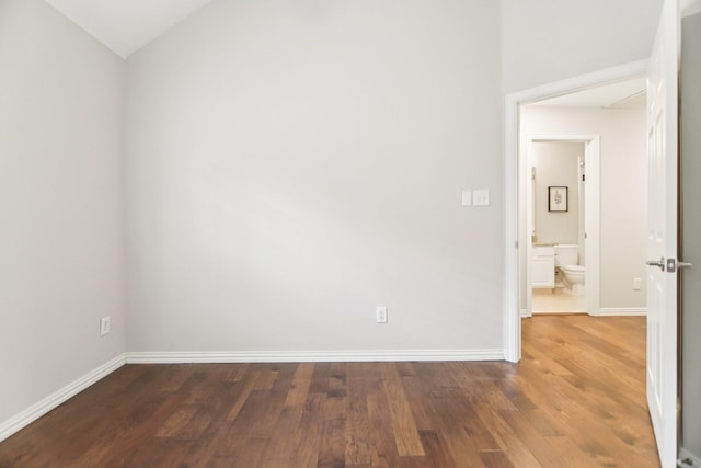 4118 Armistice Dr, Frisco, TX 75034 - spare room featuring baseboards, vaulted ceiling, and wood finished floors