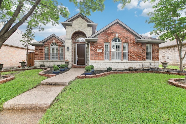 4118 Armistice Dr, Frisco, TX 75034 - view of front of house with stone siding, brick siding, and a front lawn