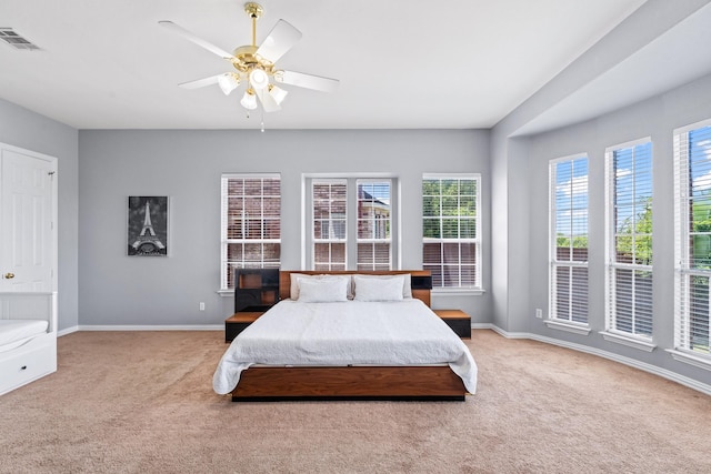 bedroom featuring carpet, baseboards, and ceiling fan
