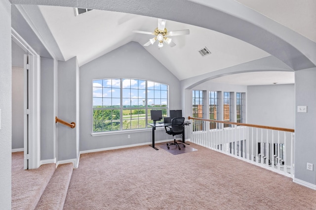 carpeted home office with vaulted ceiling, a ceiling fan, and baseboards