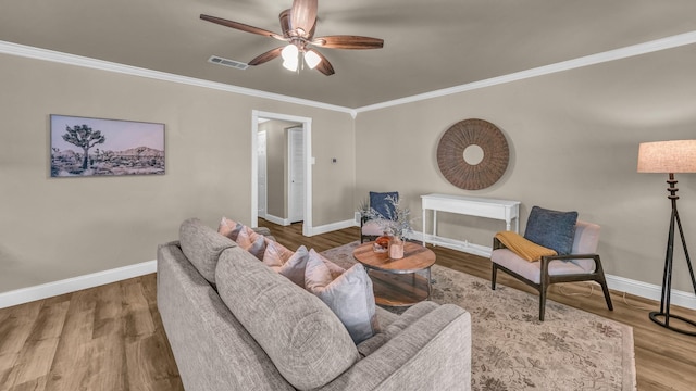 521 S Kate St, White Settlement, TX 76108 - living room with wood finished floors, a ceiling fan, crown molding, visible vents, and baseboards