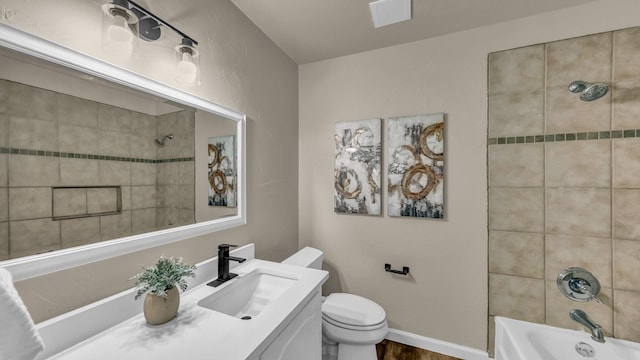 521 S Kate St, White Settlement, TX 76108 - bathroom featuring vanity, toilet, and shower / bath combination