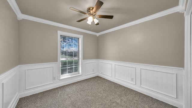 521 S Kate St, White Settlement, TX 76108 - spare room with a wainscoted wall, a ceiling fan, ornamental molding, and dark carpet