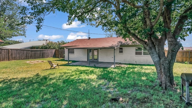 521 S Kate St, White Settlement, TX 76108 - back of house with a lawn, a patio, french doors, and a fenced backyard