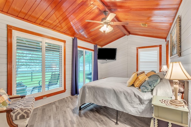 2204 County Road 1570, Alba, TX 75410 - bedroom featuring wood ceiling, wooden walls, wood finished floors, lofted ceiling, and access to outside
