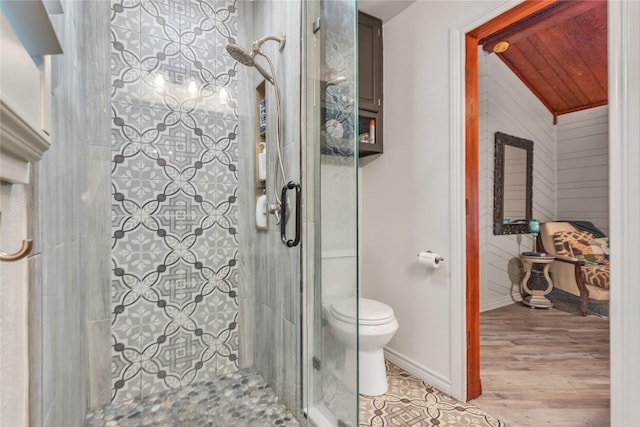 2204 County Road 1570, Alba, TX 75410 - full bathroom with a shower stall, toilet, wood finished floors, and baseboards