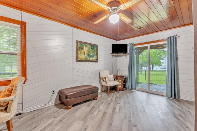 2204 County Road 1570, Alba, TX 75410 - sitting room with wooden ceiling, wood finished floors, wood walls, and a ceiling fan