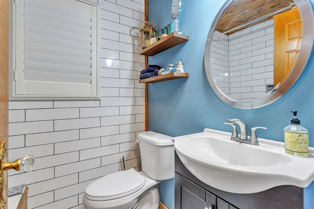 2204 County Road 1570, Alba, TX 75410 - half bathroom with toilet, vanity, and a textured wall