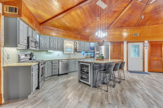 2204 County Road 1570, Alba, TX 75410 - kitchen with gray cabinets, appliances with stainless steel finishes, light wood-type flooring, wine cooler, and wooden ceiling