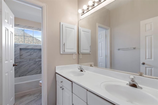 1424 Indian Spgs, Carrollton, TX 75007 - full bath featuring double vanity, toilet, marble finish floor, and a sink