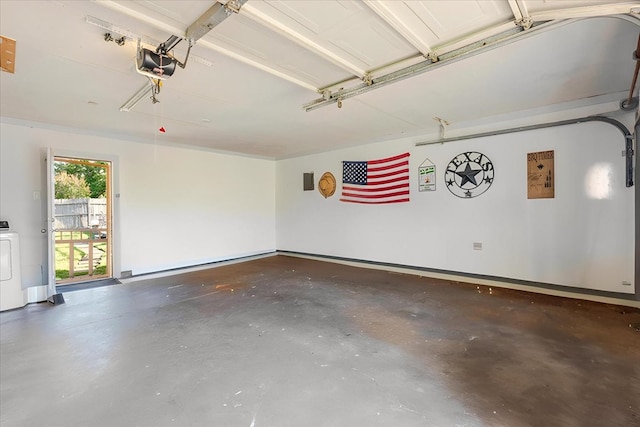 garage featuring washer / dryer and a garage door opener