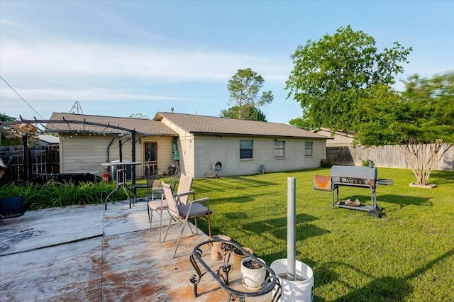 back of property featuring a yard, a patio area, and a fenced backyard
