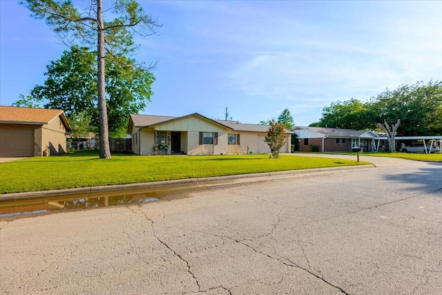 single story home with concrete driveway, a front lawn, a garage, and fence