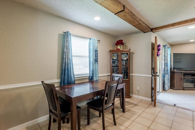 dining space featuring a textured ceiling, light tile patterned flooring, beamed ceiling, and recessed lighting