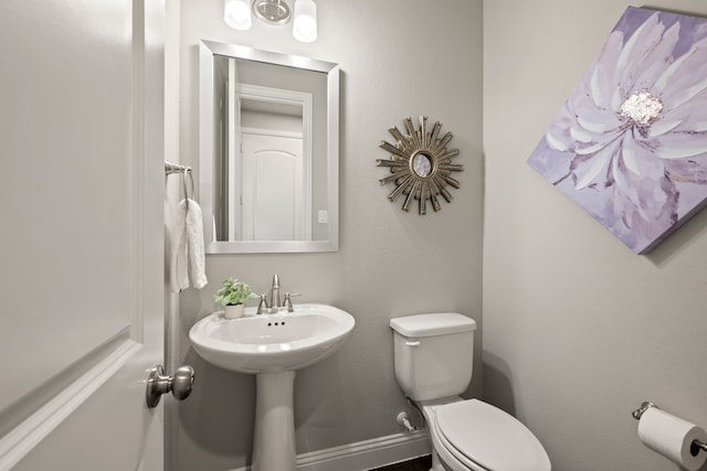 half bath featuring toilet