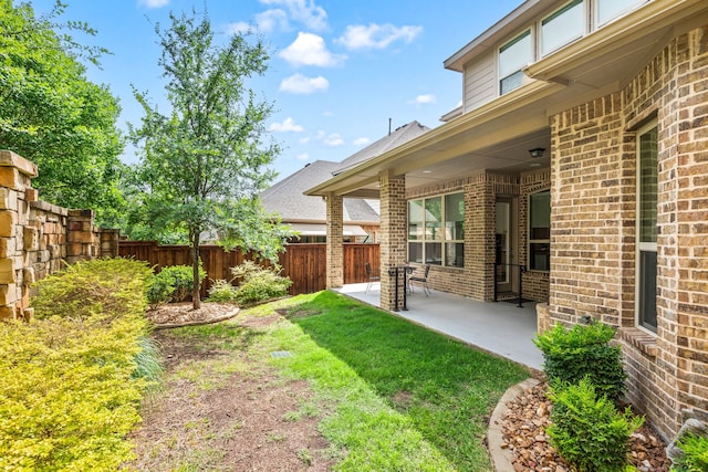 view of yard with a patio and a fenced backyard