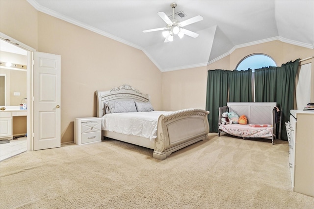 bedroom featuring lofted ceiling, ornamental molding, ceiling fan, and carpet floors