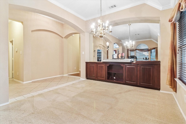 bar featuring arched walkways, a notable chandelier, tile patterned flooring, and baseboards
