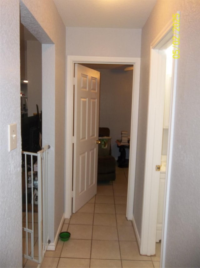 corridor with light tile patterned floors
