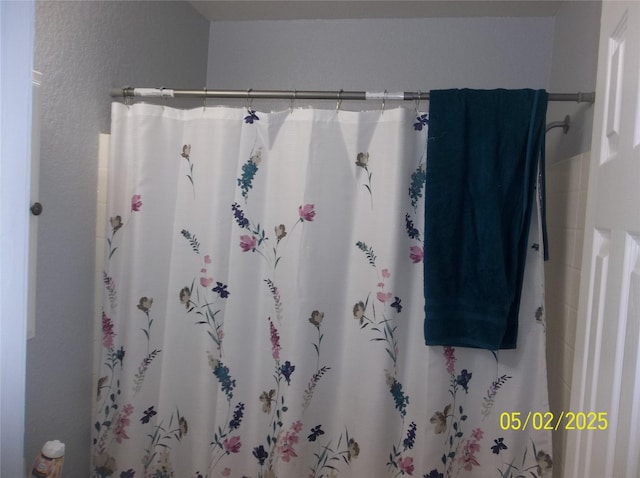 full bathroom with a shower with shower curtain