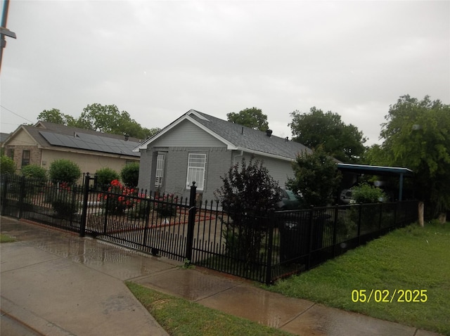 view of front of house featuring fence private yard and brick siding