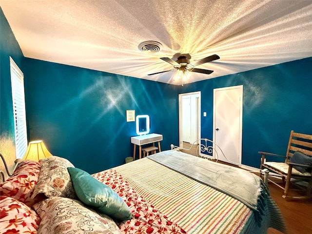 152 N Imperial Dr, Denison, TX 75020 - bedroom with a textured ceiling and ceiling fan