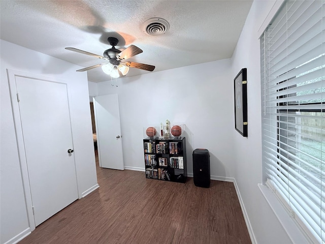 152 N Imperial Dr, Denison, TX 75020 - interior space with wood finished floors, a textured ceiling, and a ceiling fan