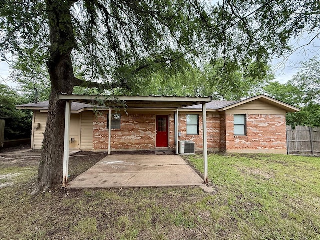 152 N Imperial Dr, Denison, TX 75020 - rear view of property featuring a patio area and brick siding
