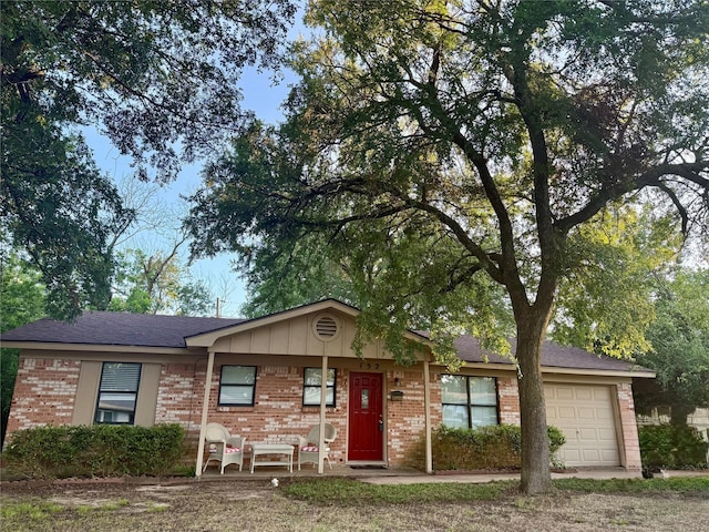 152 N Imperial Dr, Denison, TX 75020 - ranch-style house featuring brick siding, a garage, and covered porch