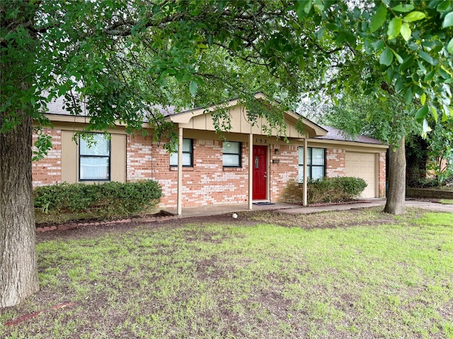 152 N Imperial Dr, Denison, TX 75020 - ranch-style house with a garage, brick siding, and a front yard