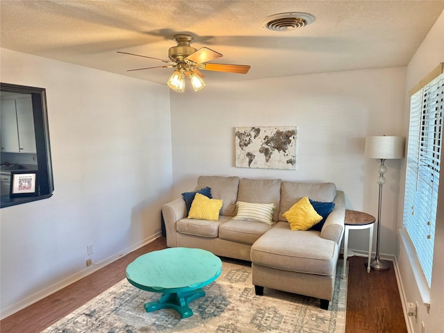 152 N Imperial Dr, Denison, TX 75020 - living room with wood finished floors, a ceiling fan, and a textured ceiling