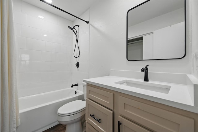 bathroom with toilet, shower / tub combo with curtain, wood finished floors, and vanity
