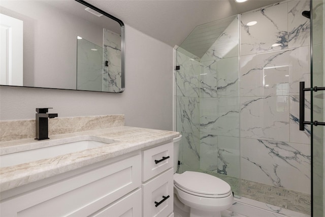 7196 Hawkeye Rd, Krum, TX 76249 - full bath featuring a marble finish shower, marble finish floor, vanity, and toilet