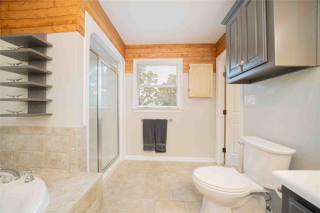 full bath with a stall shower, toilet, a bath, tile patterned flooring, and vanity