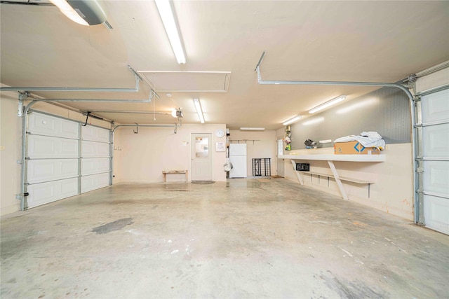 garage with freestanding refrigerator