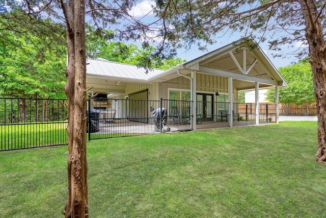 10 Holland St, Pottsboro, TX 75076 - back of house featuring board and batten siding and a patio