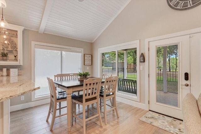 10 Holland St, Pottsboro, TX 75076 - dining space with light wood-type flooring, high vaulted ceiling, baseboards, and beamed ceiling